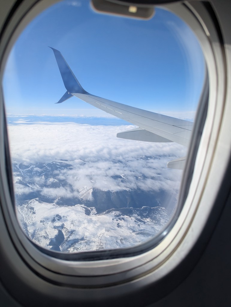 View from an airplane window during a long flight, representing comfortable and calm travel.